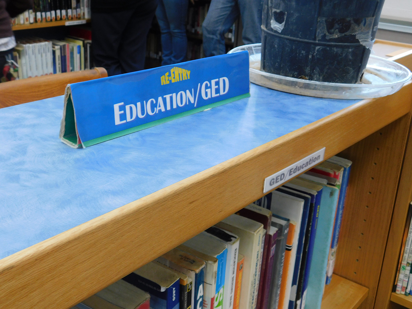 A bookshelf with education and GED books