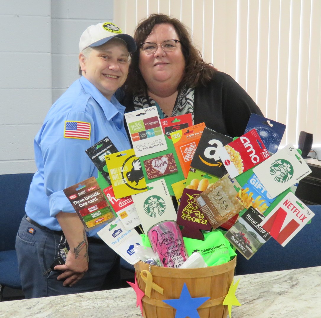 Greene employees with a basket they donated
