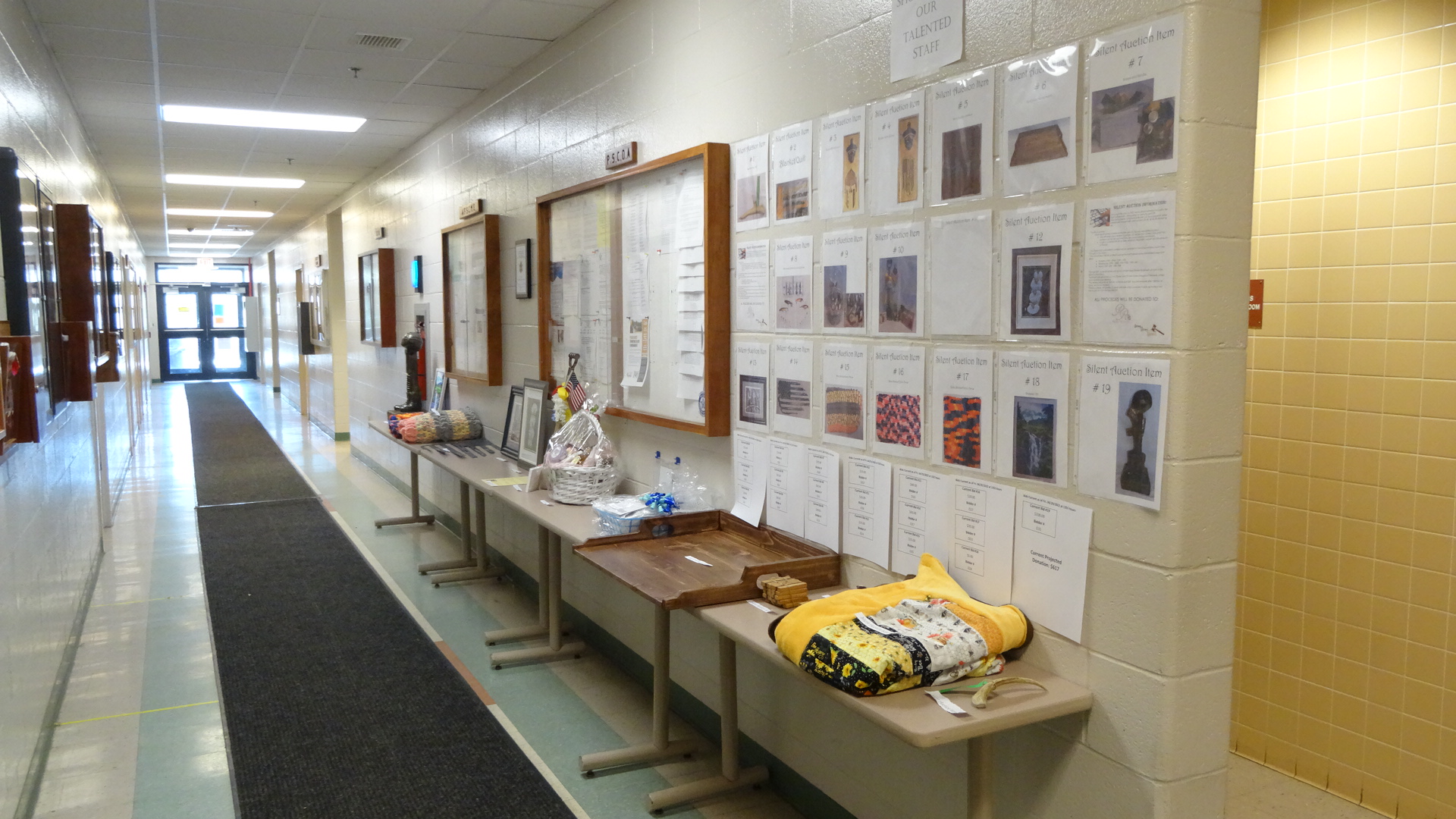 A hallway with silent auction items in it