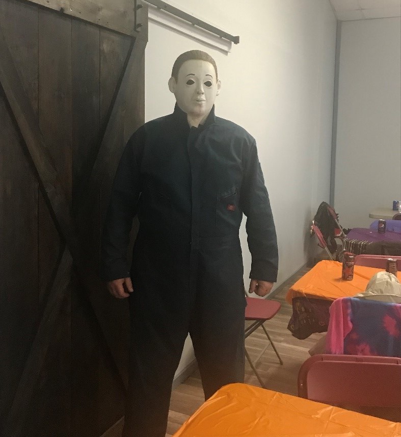 An SCI Retreat employee in a Michael Myers costume