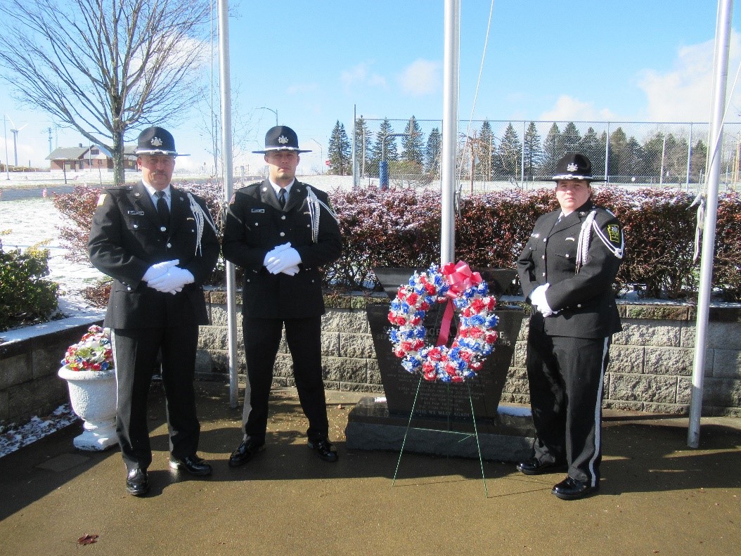 Waymart's Honor Guard stands with a wreath