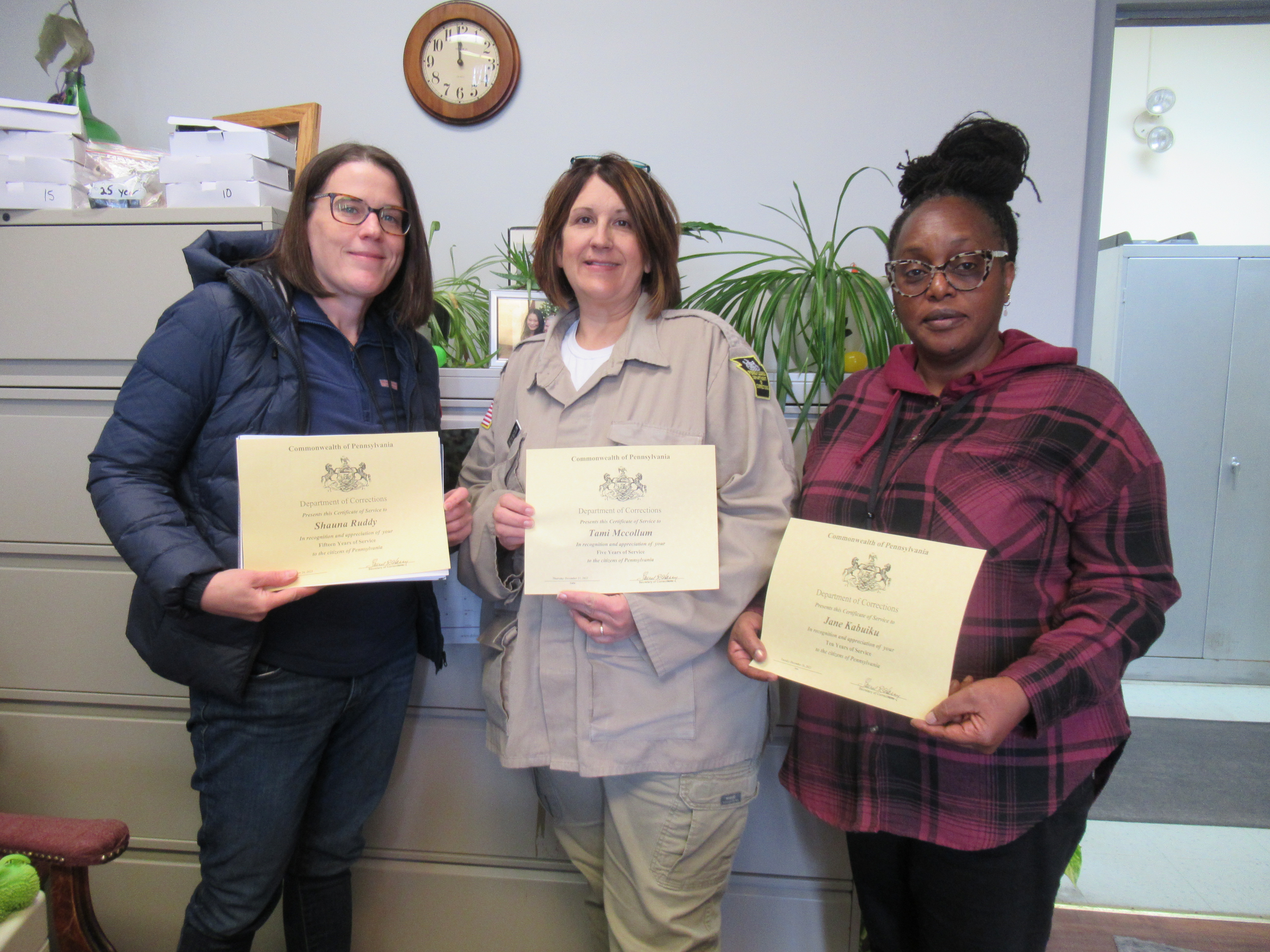 ABE Teacher Shauna Ruddy, Cosmetology Instructor Tami Mccollum and Guidance Counselor Dr. Jane Kabuiku holding certificates
